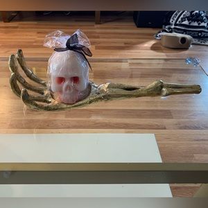 Metal Skeleton Hand Candle Holder with Skull Candle.